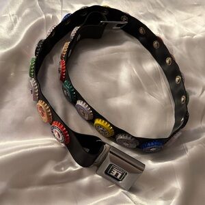 Little Earth Black ♻️ Belt Adjustable and a seat belt closure.